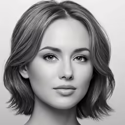 an attractive woman with a short haircut and eyeshade