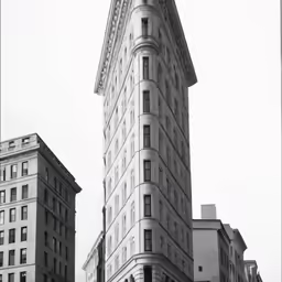 tall buildings stand near each other in a city