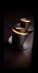 three cups sitting on top of black plate