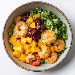 a salad with fruits and vegetables in it
