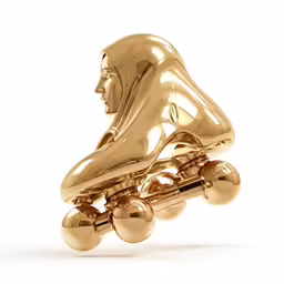 gold figure of a person riding a skateboard