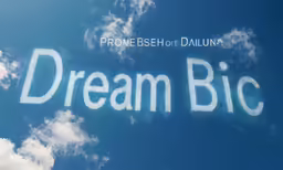 the words dream big written in bright blue sky