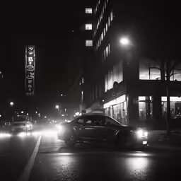 a car that is parked in the street at night