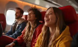 there are some people sitting together in the airplane