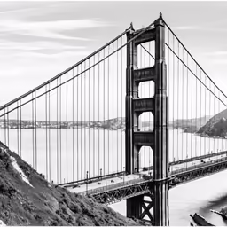 a beautiful view of the golden gate bridge with cars going over it