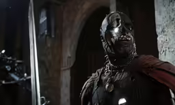 a dark knight holding a sword in a darkened castle