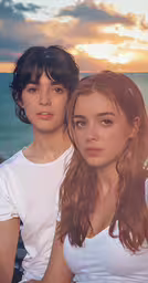 two young women are posing for a picture,two beautiful young women with long hair, sitting next to each other
