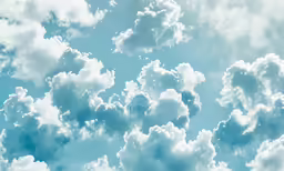 blue sky with white clouds and a lone plane in the distance