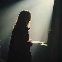there is a person standing in the dark