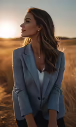 woman wearing a gray blazer standing in the middle of a field