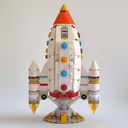 a toy rocket with small bricks on top of it,a model of a white space shuttle with blue, yellow and red trim
