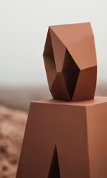 the brown sculpture has a very unusual look