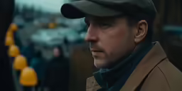 a man with a cap in the background