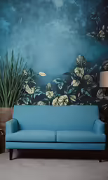 a blue couch in front of a painting of flowers