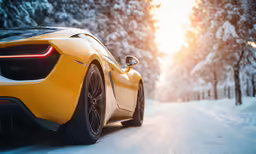a yellow sports car driving on the road near a forest