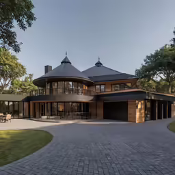 a very nice looking house with a brick walkway
