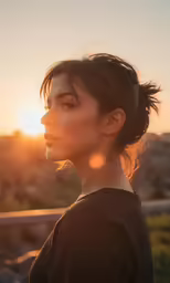 a woman with a bun hair style looking off into the distance