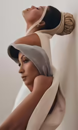 two women with black and white hair are posed next to each other