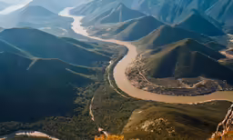 aerial view of river and mountains from above