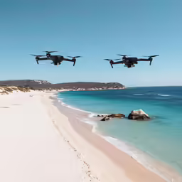three propellers are shown flying over a beach next to the ocean