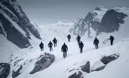 people walk up a snowy mountain while walking through the snow