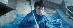 the man is standing with a umbrella in his hand