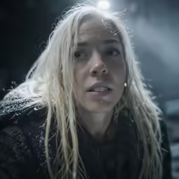 the blonde woman has rain all over her face