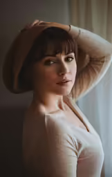 a very pretty woman with a nice short hair