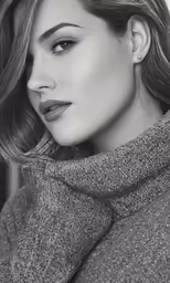 a woman in grey is wearing a scarf
