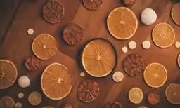 a group of orange slices sliced in half on a table