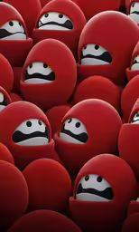 a large group of red objects with faces