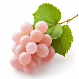 a bunch of pink grapes next to a green leaf