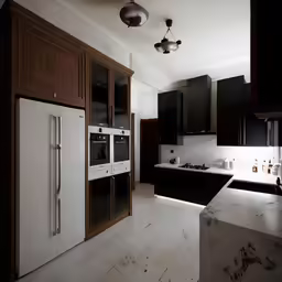 a black and white kitchen is shown with a modern refrigerator and oven