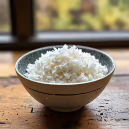 a bowl of rice sitting on a table