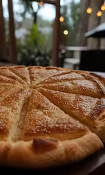 a pie topped with slices of pears on a plate