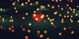 some paper balls floating around and a heart