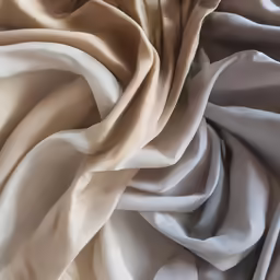 a photo of soft and light colors of fabric