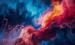 a very colorful fire and smokes with the colors rainbow