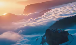 some people are on a hill and some are above the clouds
