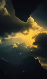 clouds, lights and stars shining on top of mountains