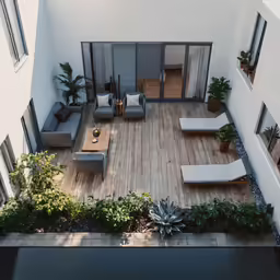view from top floor looking into living area and open deck