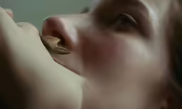 the woman is taking her nose examined