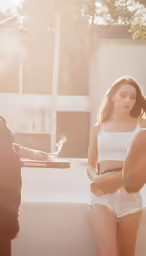 a person standing near a person holding something