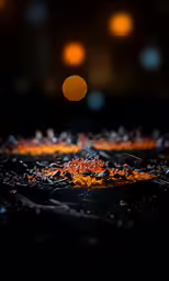 a blurry photo of a dark surface with some lights