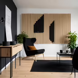 black furniture and wooden wall panels in a room