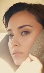 an attractive lady is holding on to her neck