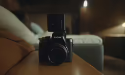 a camera sits on top of a table in a living room