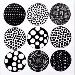 an image of black and white designs,art work showing various black circles with white dots