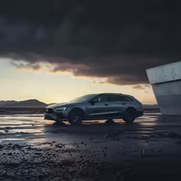 a grey suv parked in the middle of nowhere