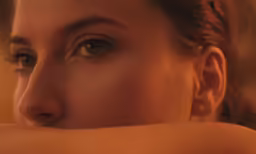 a young woman is shown with a single eye open